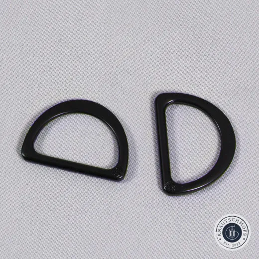 D-Ring flach Schwarz Zwei ByAnnie's D-Ringe flach in Schwarz auf grauem Stoffuntergrund