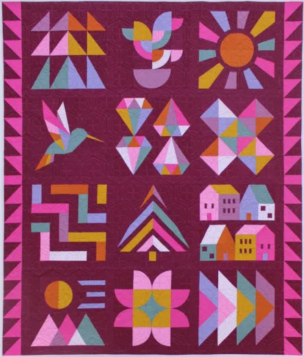 Sampler-Quilt Jewel Grotto mit bunten Blöcken auf beerenfarbenem Grund, Hand + Soul 2027 Block of the Month