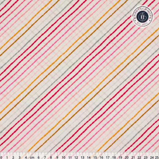 Jolly Ribbons Festive – Gesamtansicht mit Lineal Cremefarbener Baumwollstoff mit bunten diagonalen Streifen in Rot, Pink, Gold und Grau, Gesamtansicht mit Lineal