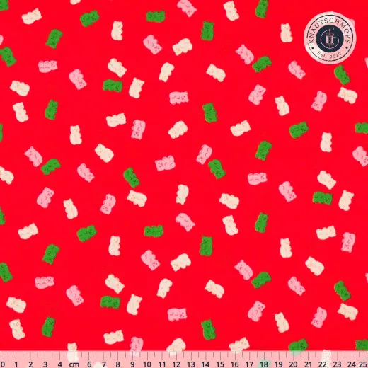 Baumwollstoff Merry Gummies Lollipop: rosa, creme und grüne Gummibärchen auf rotem Grund mit Zentimeter-Lineal