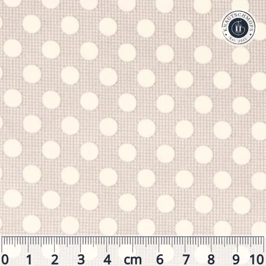 Baumwollstoff mit cremefarbenen Punkten (ca. 7mm) auf grauem Grund, Musterausschnitt mit Maßstab-Lineal.