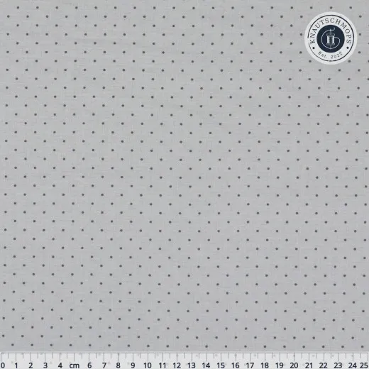Kleine Punkte des Musters „Tiny Dots" in Fog (helles Grau in Grau), Lineal zum Größenvergleich.