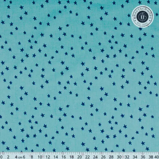 Ruby Star Society Blenders Star Starry Turquoise Türkisfarbener Baumwollstoff mit dunkelblauen handgezeichneten Sternen, mit Zentimeter-Maßstab am unteren Bildrand.