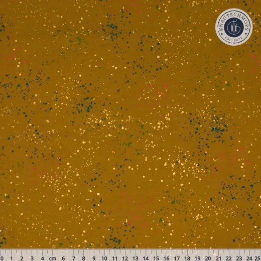 Ruby Star Society Speckled Stoffmuster in Metallic Suede, flach ausgebreitet mit Zentimeter-Maßband.