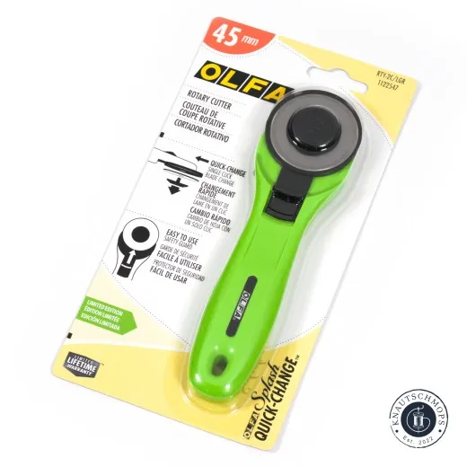 Rückseite der Olfa-Rollschneider-Verpackung mit Feature-Übersicht in Englisch, Französisch und Spanisch.