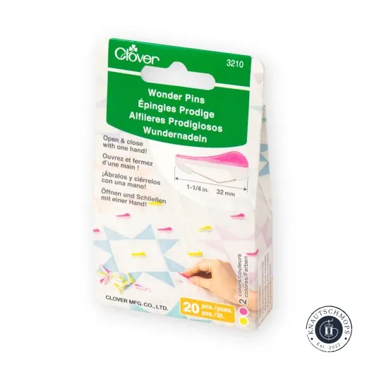 Verpackung der Clover Wonder Pins schräg mit Größenangabe und Anwendungsbild auf Patchwork-Stoff