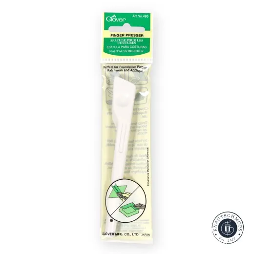 Verpackte Clover Finger Presser Falzhilfe mit Anwendungshinweisen auf der Vorderseite.