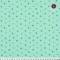 Baumwollstoff Mint mit grünem Weihnachtskonfetti aus Zuckerstangen, Sternen und Tannen, mit Lineal in cm
