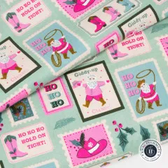 Nahaufnahme der Briefmarken-Motive mit Cowboy-Santa, Lasso und Ho Ho Ho Schriftzug in Pink