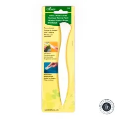Originalverpackung des Clover Point 2 Point Turners mit Anwendungsbeispielen zum Wenden von Ecken und Markieren von Falten.