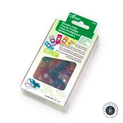 Verpackung der Clover Wonder Clips schräg von der Seite mit bunten Klammern im Sichtfenster