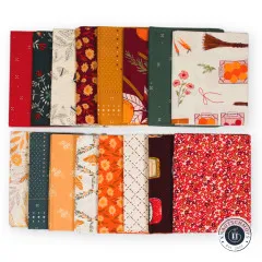 Alle 16 Fat Quarters flach nebeneinander ausgelegt, von Rot über Ocker bis Tannengrün.