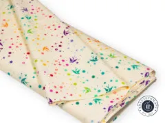 Gefaltete Stoffbahn des Tula-Pink-Stoffs „Fairy Dust“ in Cotton Candy, mit Blick auf den Stoffbruch.