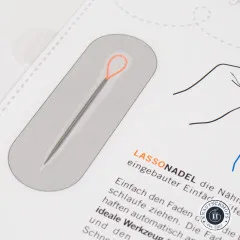Nahaufnahme der Lasso Nadel mit oranger Kunststoffschlaufe im Blister