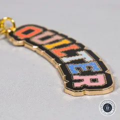 Makroaufnahme des Schriftzugs „Quilter“ mit gemusterten Buchstaben.