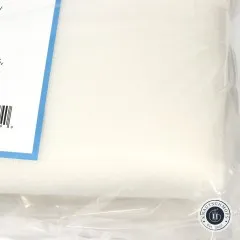Nahaufnahme der genoppten Stoffoberfläche des Schaumstoff-Stabilisators am Verpackungsrand.