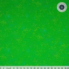 Speckled Verdant Stoffmuster in Großansicht mit Zentimeter-Maßband, gut erkennbar die bunten Farbtupfer auf grasgrünem Fond.