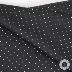Diagonale Nahaufnahme des Punkte-Musters „Tiny Dots" in Carbon mit sichtbarer Webstruktur.