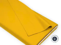 Art Gallery Fabrics Pure Solids Aurus, senfgelber Baumwollstoff auf Stoffrolle gefaltet