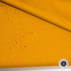 Senfgelber Speckled Stoff mit roten Sprenkeln, diagonal gefaltet, Stoffstruktur sichtbar