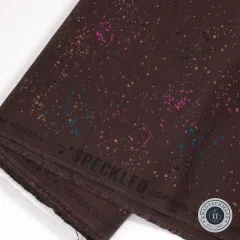 Detailaufnahme der Webkante mit Schriftzug 'Speckled' und Materialangaben (70% Baumwolle, 30% Leinen)
