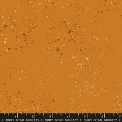 Musterausschnitt der Canvas-Struktur mit bunten Metallic-Farbspritzern auf terrakottafarbenem Fond, mit Zentimetermaß.