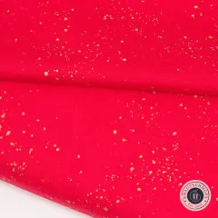 Drapierter Stoff „Speckled" in Scarlet in enger Nahaufnahme, mit Knautschmops-Logo.