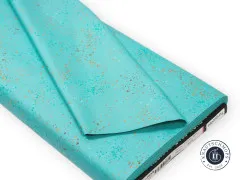 Stoffballen Speckled Turquoise von Ruby Star Society mit Etikett und Webkante