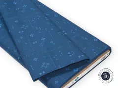 Gefalteter Stoffballen mit Etikett Decostitch Indigo Sky und OEKO-TEX-Siegel.