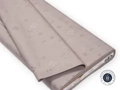 Gefalteter Stoffballen mit Etikett Decostitch Rain Cloud und OEKO-TEX-Siegel.