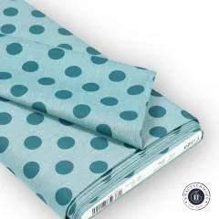 Gefalteter Stoffballen mit Etikett „Tilda Chambray Dots 160058 Aqua".
