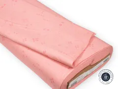 Angeschnittener und gefalteter Stoffballen mit Etikett der Decostitch-Wide-Elements-Kollektion in Peony
