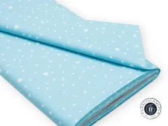 Angeschnittener und gefalteter Stoffballen mit Etikett Space Sprinkles Waterfall