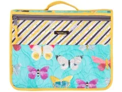 Running-with-Scissors-Case in Gelb-Schwarz mit Schmetterlings-Collagenmuster, geschlossen fotografiert.