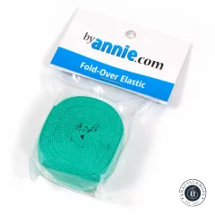 Fold-Over-Elastic Türkis in der Originalverpackung, schräg fotografiert mit gut lesbarem ByAnnie's-Etikett