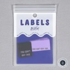 Frontale Ansicht der Verpackung mit den Metallic-Labeln 'You Can't Buy This'.