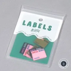 Verpackung der Kylie and The Machine Weblabels 'Fuck Yeah!' in drei Farbkombinationen.