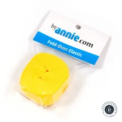 Verpacktes Fold-Over-Elastic in Gelb mit byAnnie.com-Etikett, schräg fotografiert