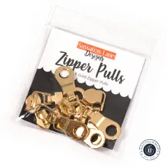 Verpackung der Sassafras-Lane-Zipper-Pulls in Gold mit Aufschrift 6 Gold Zipper Pulls auf schwarzem Hintergrund.
