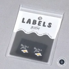 Verpackung der Kylie and The Machine Weblabels 'You're a Good Egg' mit zwei sichtbaren Labeln.