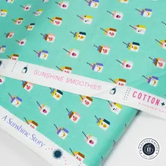Webkante mit Aufschrift Sunshine Smoothies, A Sunshine Story und Cotton + Steel auf türkisem Stoff