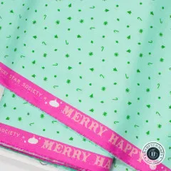 Stoffkante mit pinker Webkante und Schriftzug Merry Happy Ruby Star Society auf mintfarbenem Konfettistoff