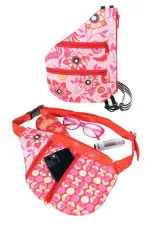 Zwei genähte Taschen flach liegend: oben in Rosa mit Blumenmuster und roten Reißverschlüssen, unten als Bauchtasche in Rot-Pink mit Vogelmotiv.